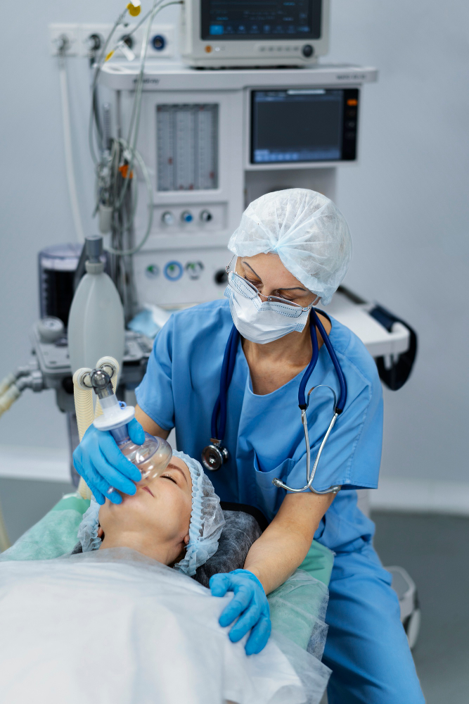 Anaesthetist placing a mask over a patient