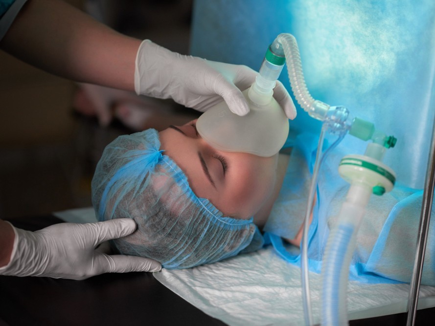 Patient relaxed with eyes closed under sedation